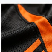 Close-up of black and orange sportswear fabric